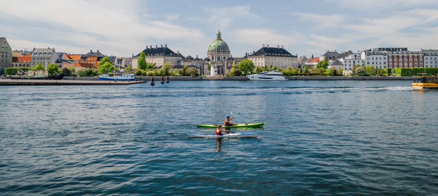 Kayaks in front of Amalienborg Castle in the harbour of Copenhagen, Denmark