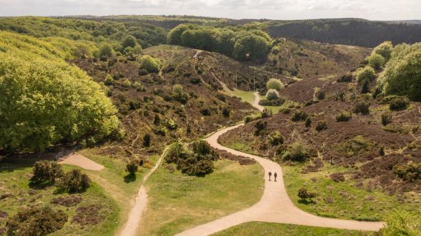 Drone shot of people hiking in Rebild Bakker, Nordjylland