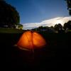 A tent pitched at Camp Møns Klint on a starry night.