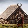 Vikinger in front of a hut, Fjordlandet