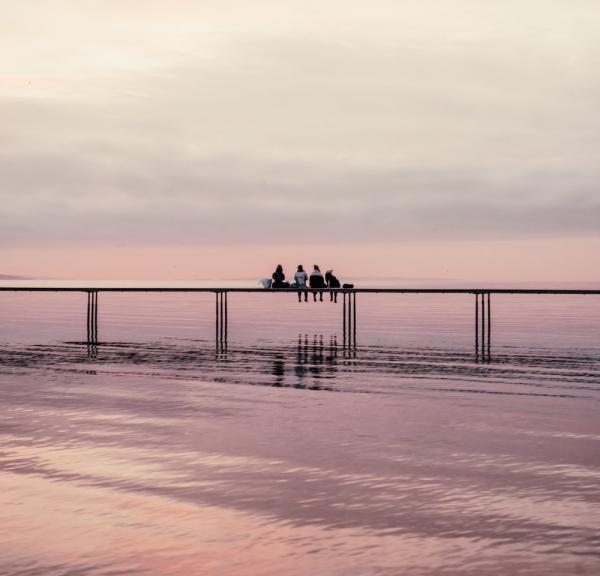 People sitting on the Infinity bridge