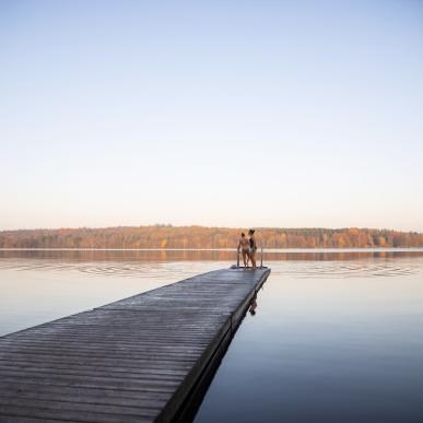 People on a pier on a lake in Rebild Bakker 