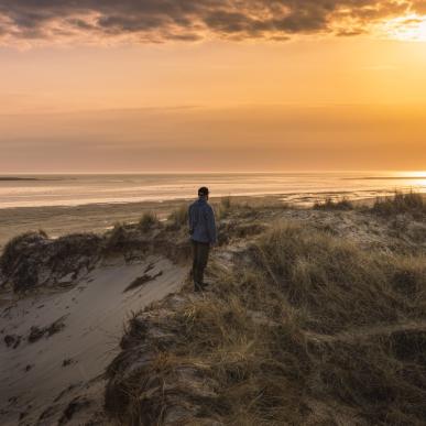 Man standing at the Wadden sea